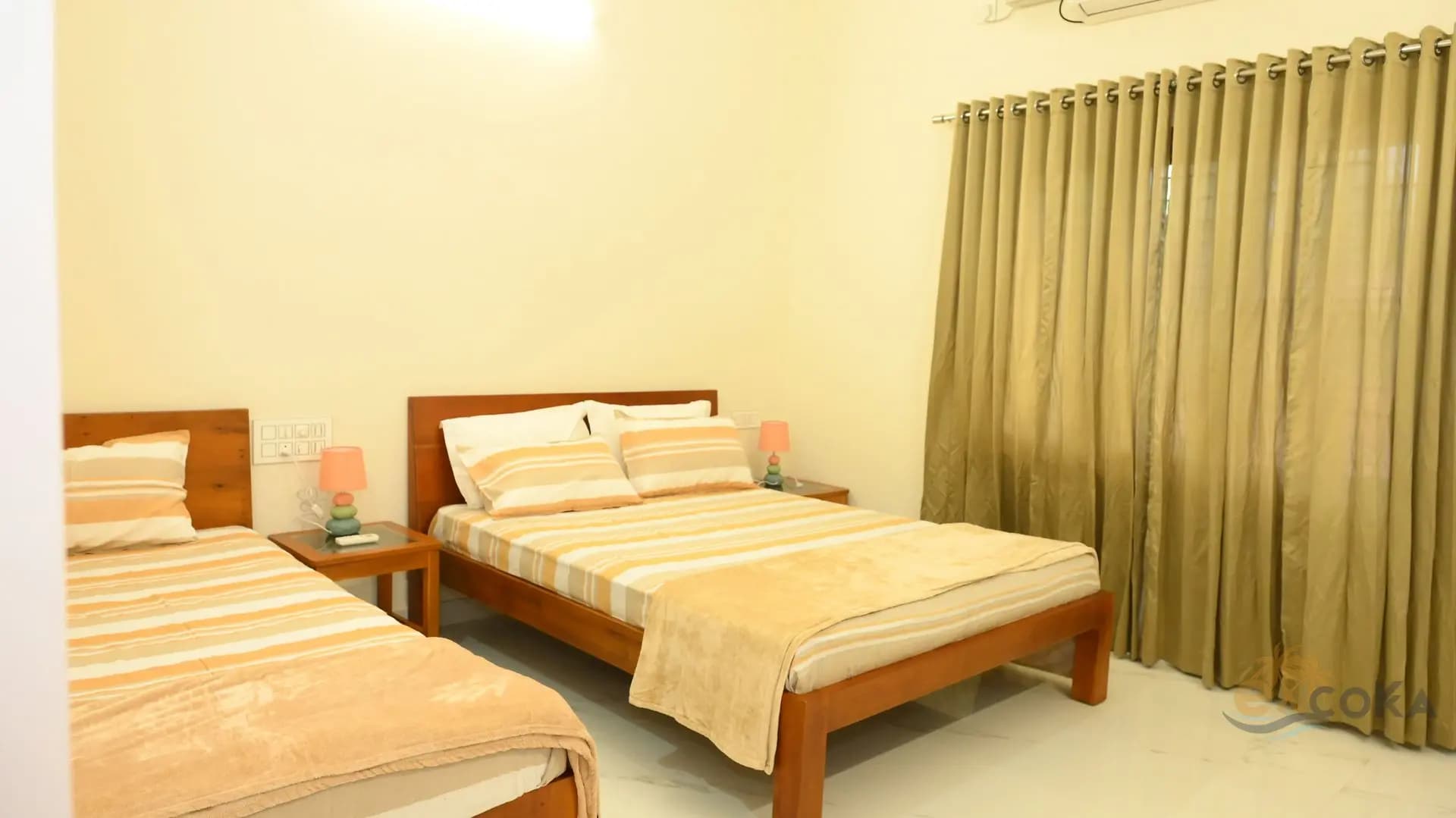 Spacious bedroom with double and single beds